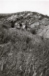 N.E. Hansen and two assistants gather specimens in their search for hardy peach trees in northern China in 1924 by South Dakota State University