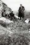 N.E. Hansen and two assistants gather specimens in their search for hardy peach trees in northern China in 1924 by South Dakota State University