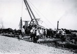 Porters lifting iron pipes at the port on Tokyo Bay at Yokohama, Japan in 1924 by South Dakota State University