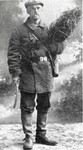 N.E. Hansen in Siberian costume with a sheaf of alfalfa in 1906 by South Dakota State University