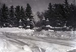 Winter scene of the campus gateway on the campus of South Dakota State College, 1936
