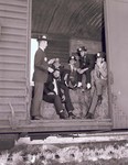 Men in a railroad car for Hobo Day promotion at South Dakota State University, 1964 by South Dakota State University